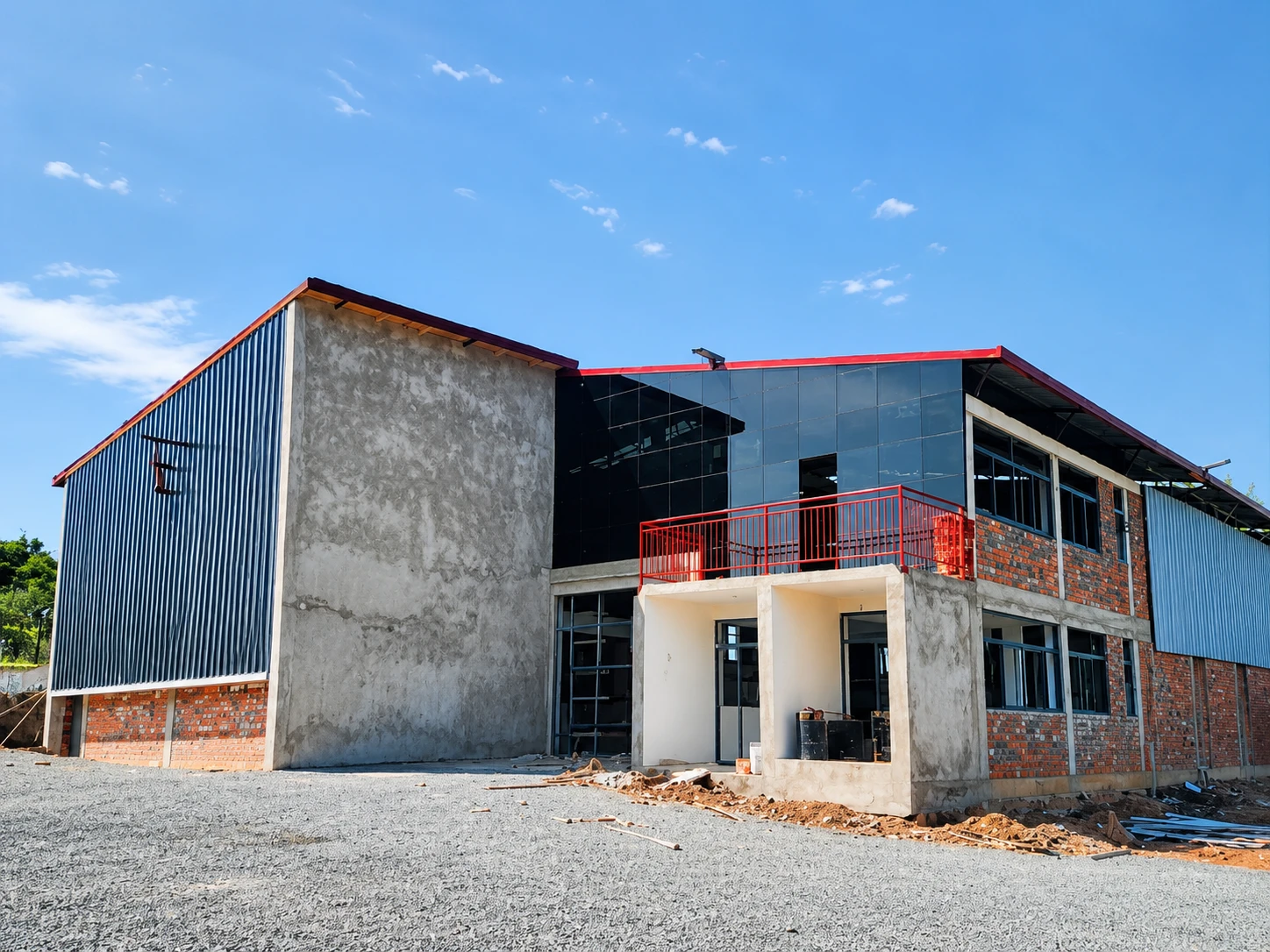 Warehouse facility for Rwanda Events Group Ltd with steel cladding, glazed upper floor and brick elevations, built by Sezibera Construction
